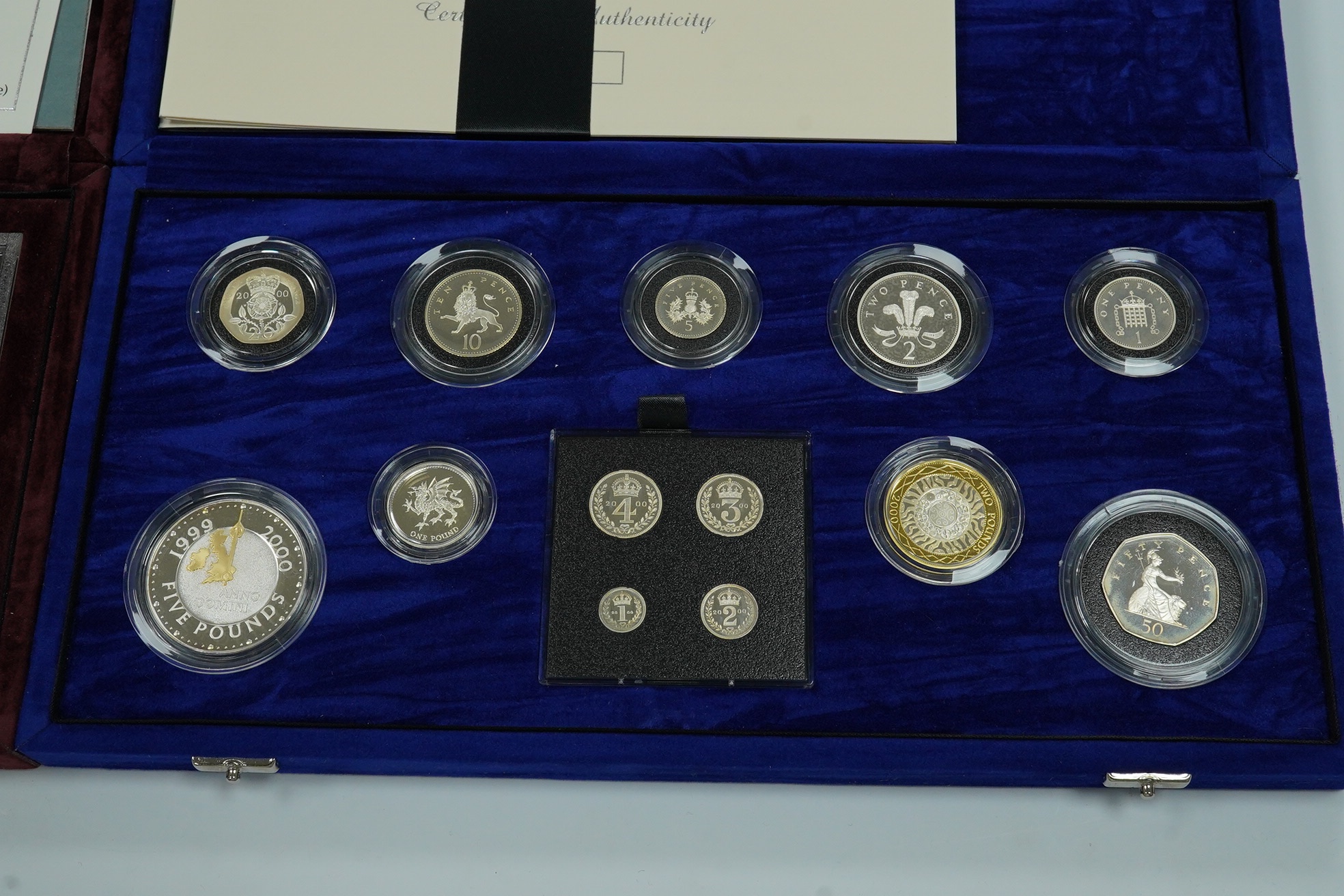 Royal Mint UK QEII coins, the Millennium Silver collection, 2000, in case of issue with certificate and Silver Anniversary collection 1996, in case of issue with certificate (2 cases)